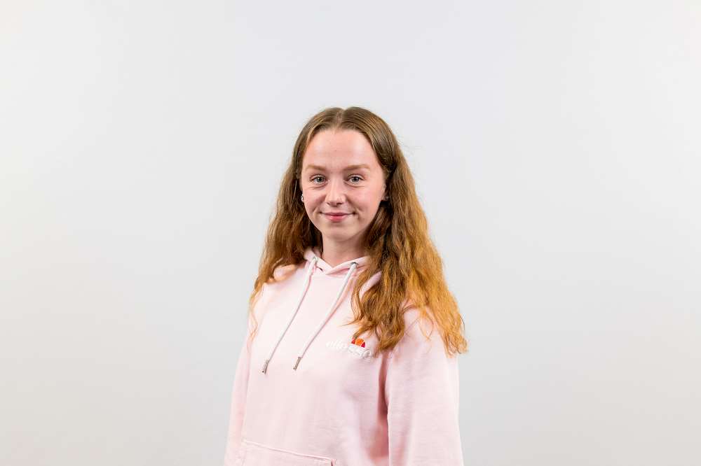 Photo of Kelsi at our awards ceremony, posing against a plain background.