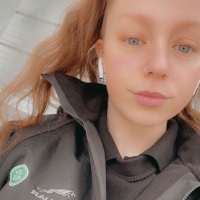 Photo of Kelsi in her Jaguar Land Rover uniform.