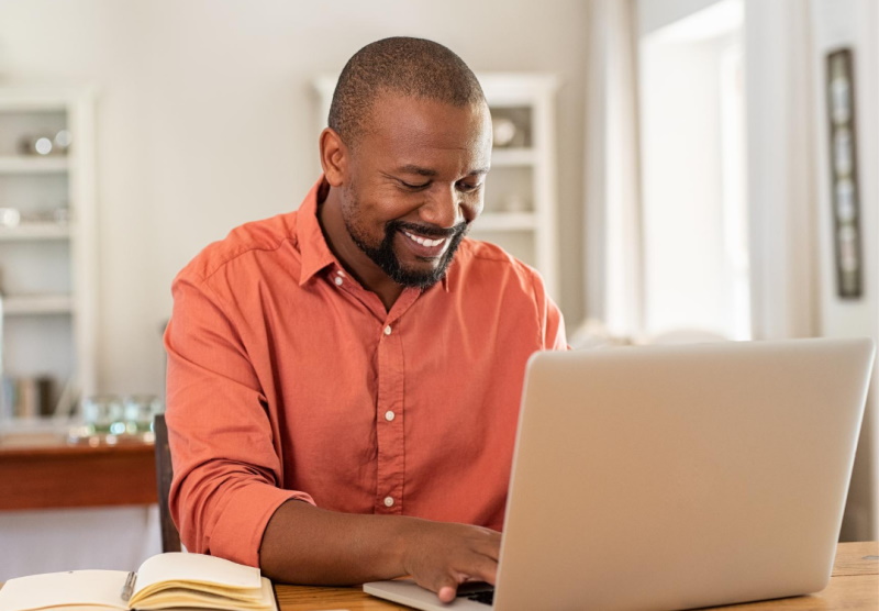 Man studying on his laptop from home