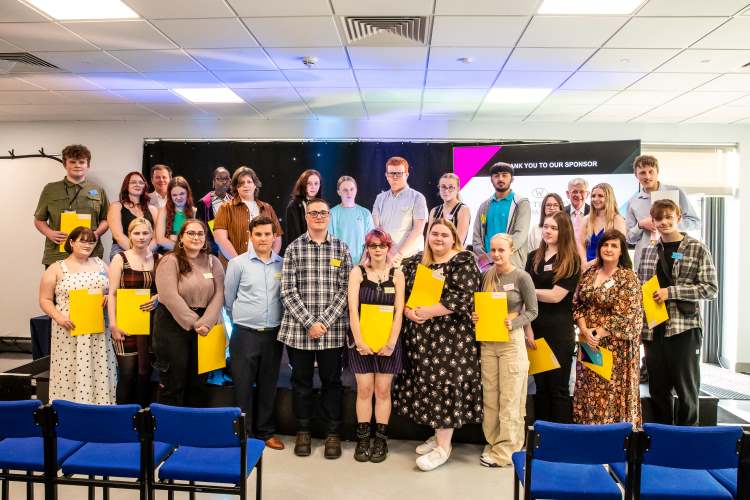 Group shot of student award winners at our Daventry Campus, all smiling and holding their certificates