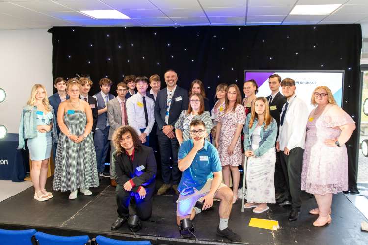 Student award winners pose on stage at Daventry Campus.