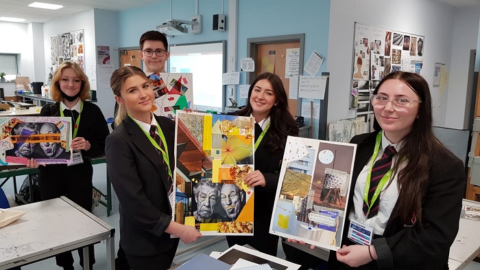 Students from local schools holding artwork created during a workshop in Daventry