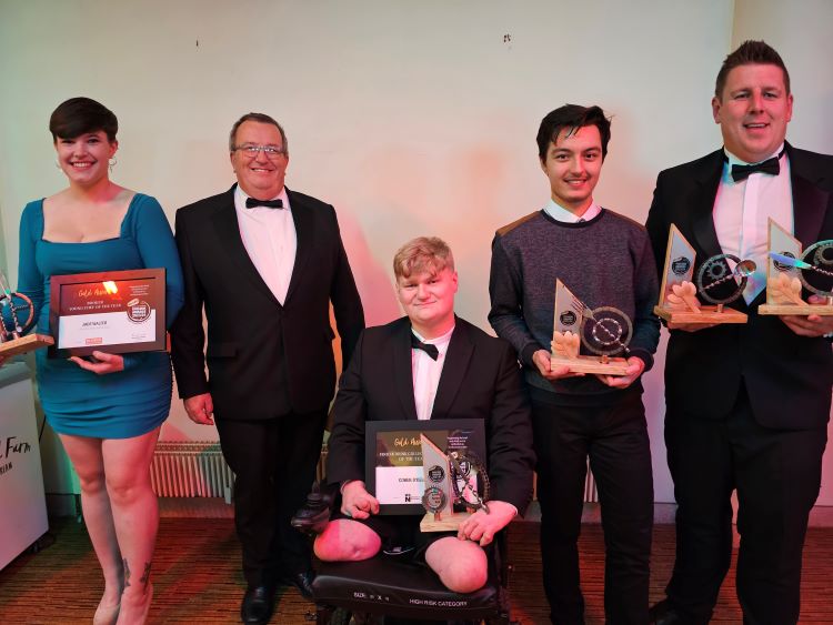 Image shows college winners, posing with their awards.