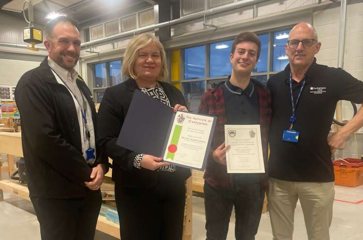 Michail holding his awardn alongside Tim, Assistant Principal Andrea Brown and Curriculum Manager Mark Bradshaw