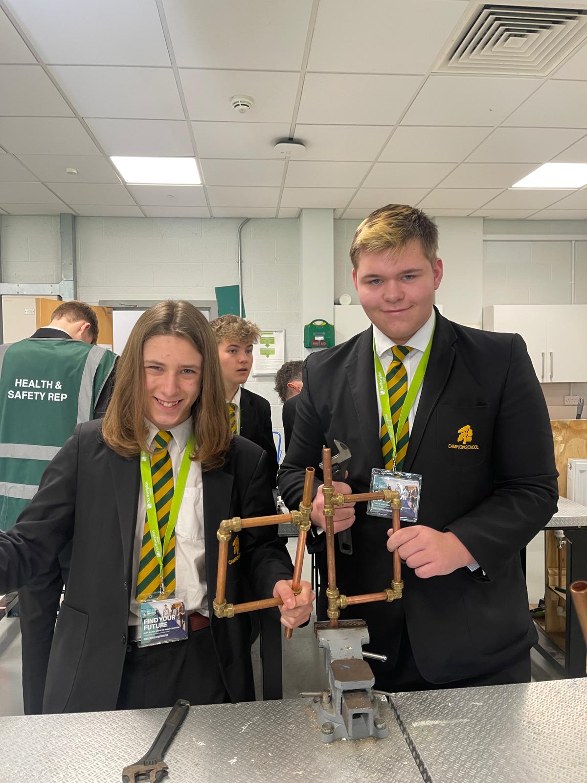 Students from Campion School pose with their copper creations