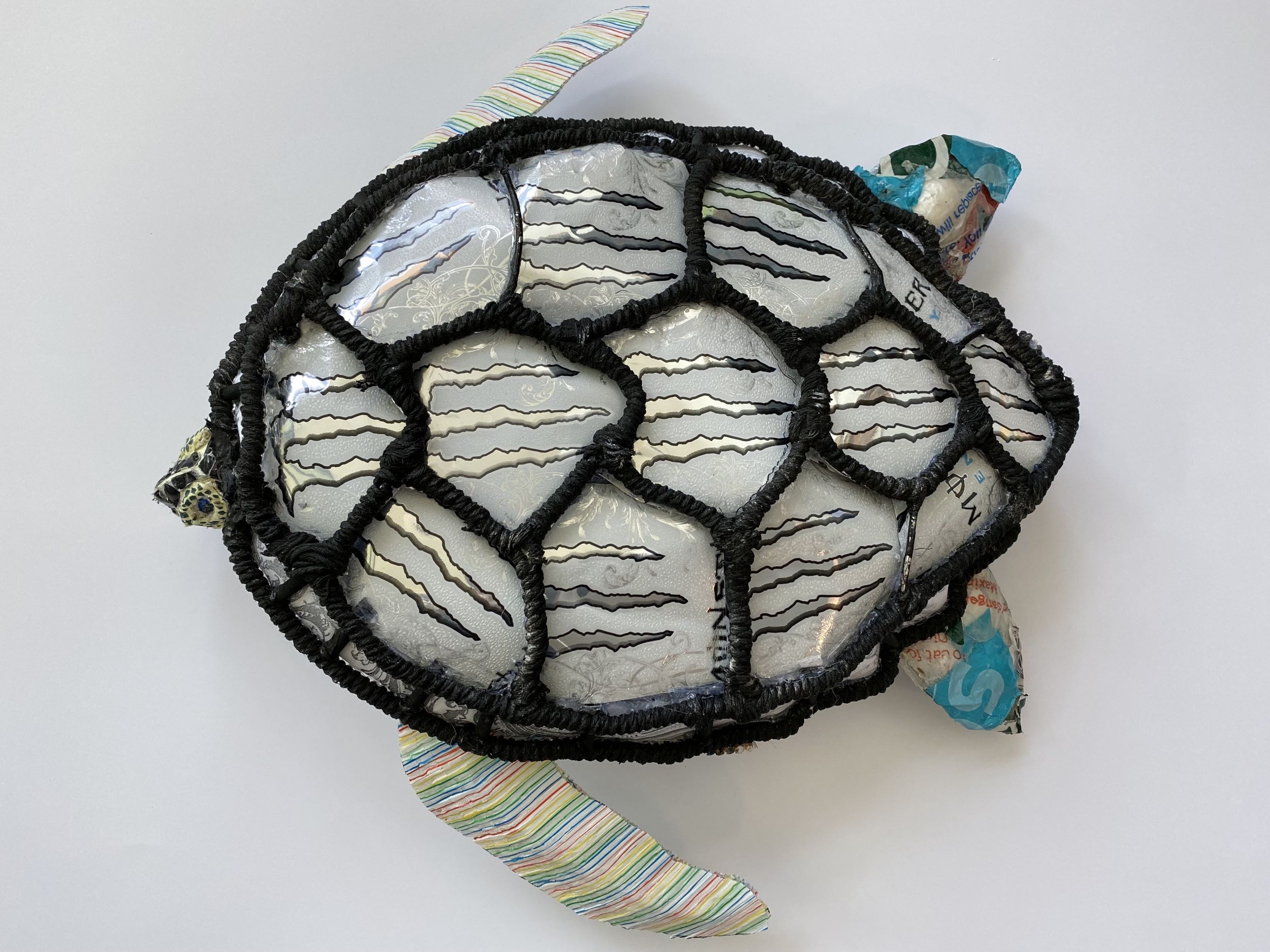 Image of a turtle made from recycled products.
