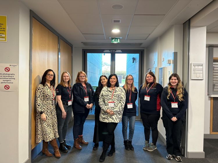 Shown in the photo, smiling to camera in a group - Lauren Kneafsey from The Qube, Hayley Barnett, Emma Watson and Eilidh MacInnes from Ilmor, Katie Newman from Bhangals Construction, Cheryl Loak from Totally Unique Training Solutions and Emma Alderman and Sophie Shacklock from Winvic Construction.