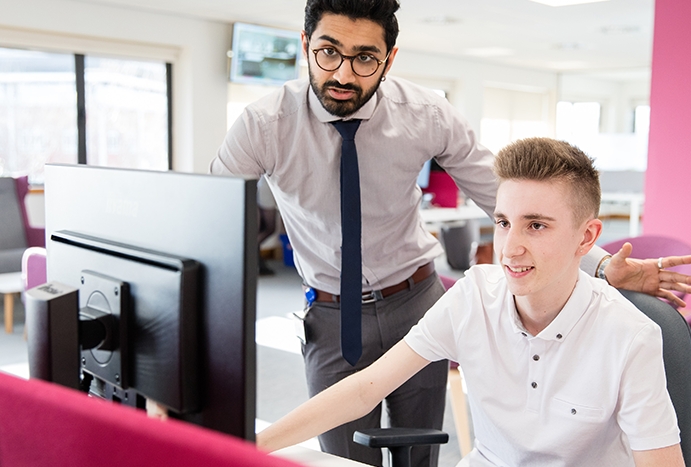 Student working with teacher