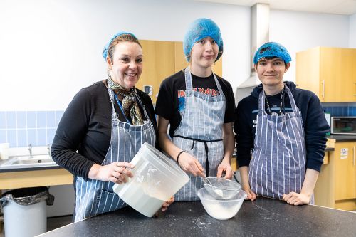 Student using equipment in the workplace
