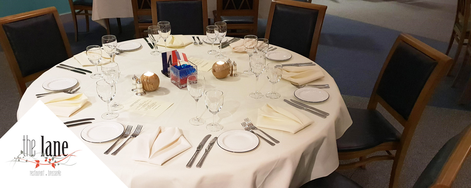 Image shows laid table at The Lane Restaurant.