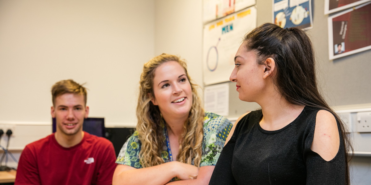 Teacher supporting students during a lesson