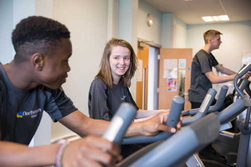 2 people working out in a gym